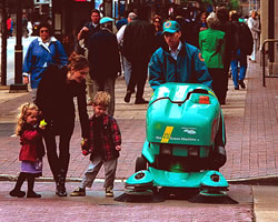 Green Machine sweeping amid crowd